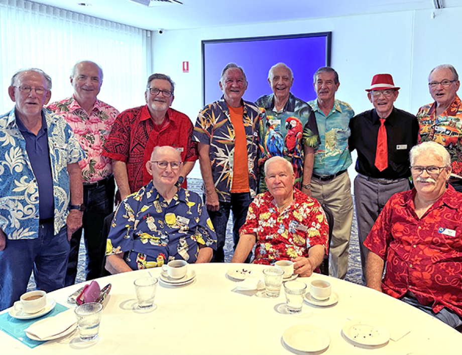 Members enjoying the Bright Clothes themed meeting.